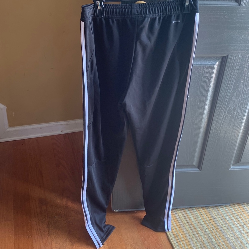 Never worn Adidas track pants size L